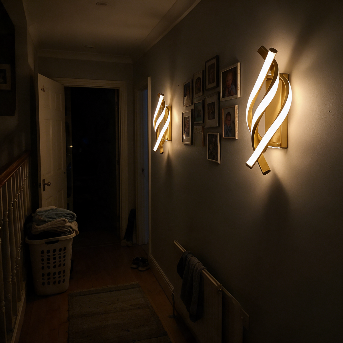 Sconces dimmed low as night lighting on a landing