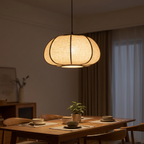 Pumpkin fabric pendant above a dining table