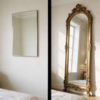 A plain frameless mirror versus the ornate arched frame