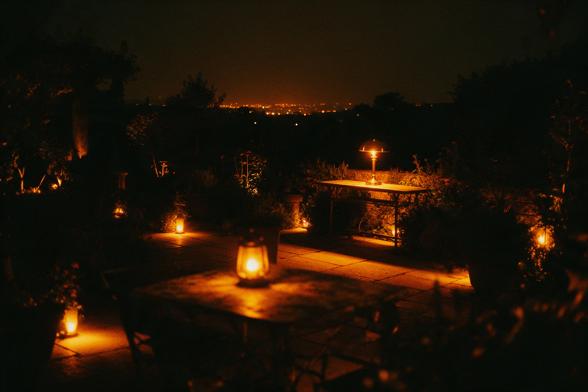 Terrace after dark with warm path lights and a glowing lantern